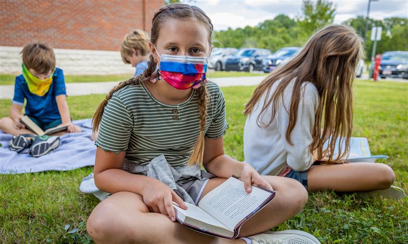 Students read books outside